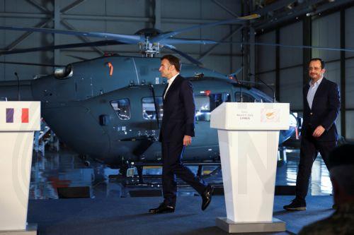 epa12806517 French President Emmanuel Macron (L), Cypriot President Nikos Christodoulides (R), and Greek Prime Minister Kyriakos Mitsotakis (not pictured) arrive to take part in a joint press conference at Paphos military airport, in Paphos, Cyprus, 09 March 2026, on the day of Macron's visit to show France's solidarity after recent drone attacks amid the...