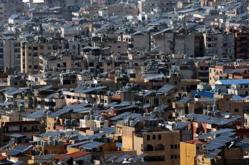 epa12807366 Solar panels are installed across the roofs of buildings in the Dahiyeh neighborhood of southern Beirut, Lebanon, 09 March 2026. The Israeli military stated it is conducting strikes across the country targeting Hezbollah infrastructure and personnel. According to the Lebanese Ministry of Public Health, at least 394 people were killed and 1,160...