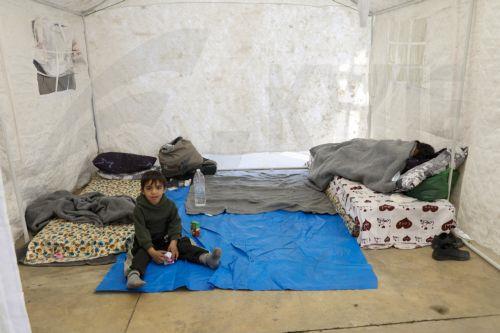 epa12811747 A child sits inside a tent at a new shelter for displaced people inside the Camille Chamoun Sports City Stadium in Beirut, Lebanon, 11 March 2026. Lebanese authorities report more than 759,000 registered displaced since the escalation began on 02 March 2026, though the true number is likely higher as many stay with relatives or rent in safer...