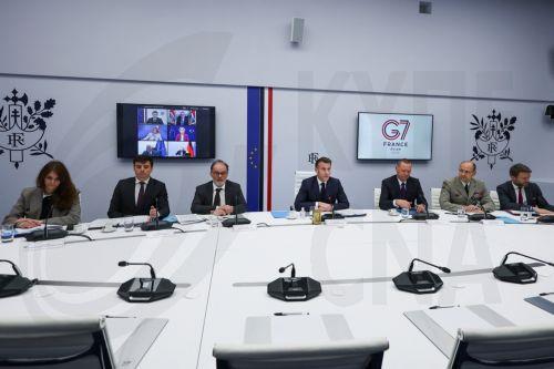 epa12811765 French President Emmanuel Macron (C) chairs a video conference of G7 leaders, next to Head Economic adviser, Matthieu Landon (2-L), Secretary General to the President of France, Emmanuel Moulin (3-L), General Vincent Giraud (2-R) and Diplomatic adviser to President, Emmanuel Bonne (3-R), to discuss the fallout of the war in Iran on the world...