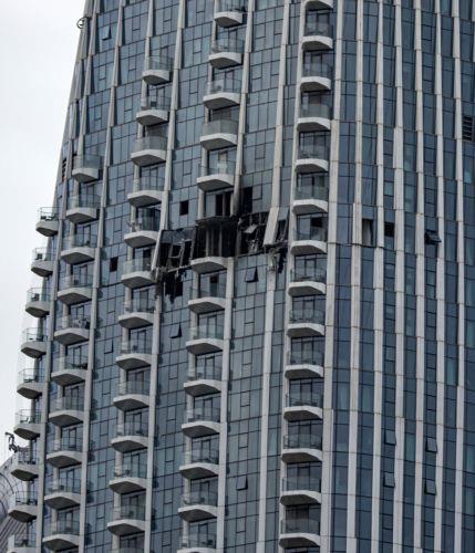 epa12814069 A view of the damaged part of the Dubai Creek Harbour Tower after it was hit by an Iranian drone attack in Dubai, United Arab Emirates, 12 March 2026.  EPA/STRINGER