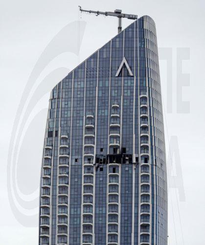epa12814073 A view of the damaged part of the Dubai Creek Harbour Tower after it was hit by an Iranian drone attack in Dubai, United Arab Emirates, 12 March 2026.  EPA/STRINGER