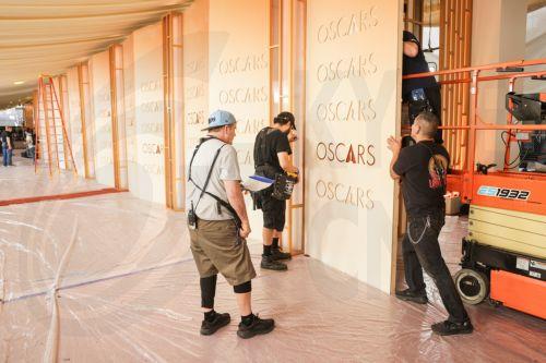 epa12815918 Workers assemble parts of the red carpet backdrop as preparations for the 98th annual Academy Awards ceremony get underway in Los Angeles, California, USA, 12 March 2026. The 98th Academy Awards ceremony will take place at the Dolby Theatre in Los Angeles on 15 March 2026.  EPA/CHRIS TORRES