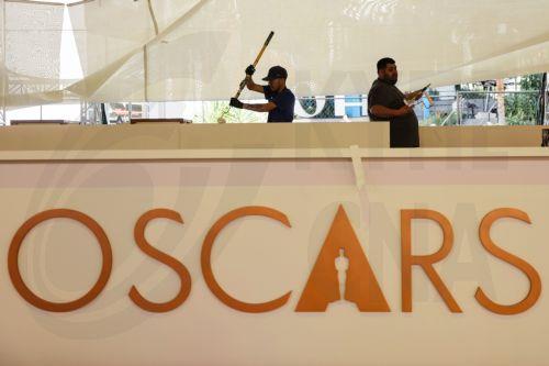 epa12815919 Workers assemble parts of the red carpet as preparations for the 98th annual Academy Awards ceremony get underway in Los Angeles, California, USA, 12 March 2026. The 98th Academy Awards ceremony will take place at the Dolby Theatre in Los Angeles on 15 March 2026.  EPA/CHRIS TORRES