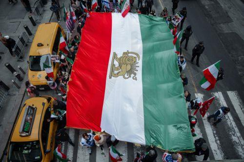 epa12823490 People carry the monarchist flag of Iran during a ‘Freedom for Iran’ protest in New York, New York, USA, 15 March 2026. The rally comes amid ongoing hostilities involving the United States, Israel and Iran.  EPA/OLGA FEDOROVA
