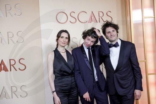 epa12824256 (L-R) French film producer Sophie Mas, French director Ugo Bienvenu and French actor Felix De Givry arrive on the red carpet ahead of the 98th annual Academy Awards ceremony at the Dolby Theatre in the Hollywood neighborhood of Los Angeles, California, USA, 15 March 2026. The Oscars are presented for outstanding individual or collective efforts...