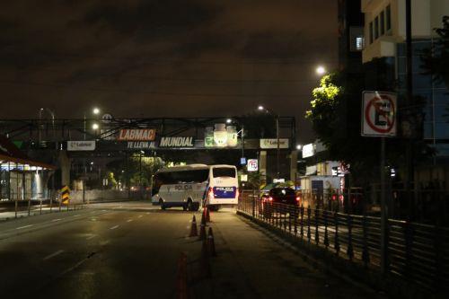 epa12824587 A police vehicle patrols a street after the imposition of curfew in Guayaquil, Ecuador, 15 March 2026. The nighttime curfew decreed by Ecuadorian President Daniel Noboa in four provinces began with the deployment of more than 75,000 soldiers and police officers to intensify the 'war' declared by the president against criminal gangs. ...